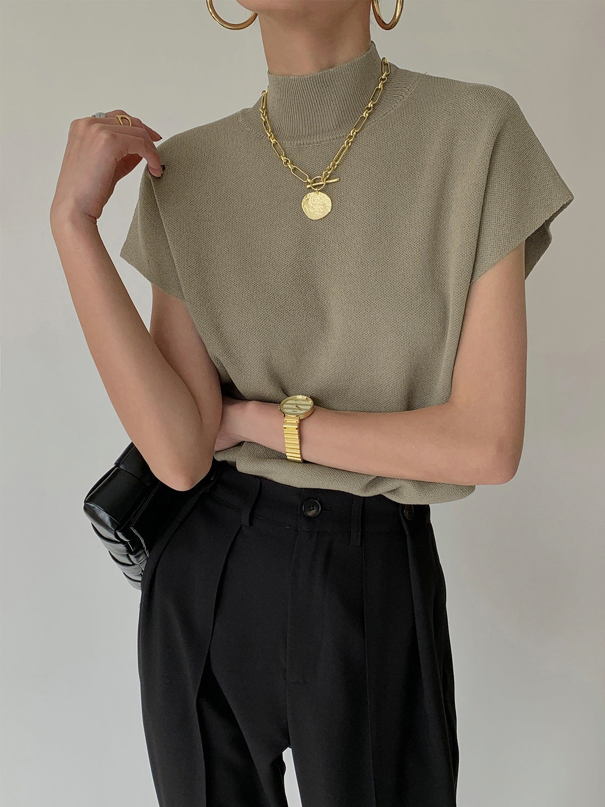 Top de Cuello Alto con Hombreras Mujer Sin Mangas